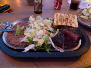 Steak with beans, salad and toast